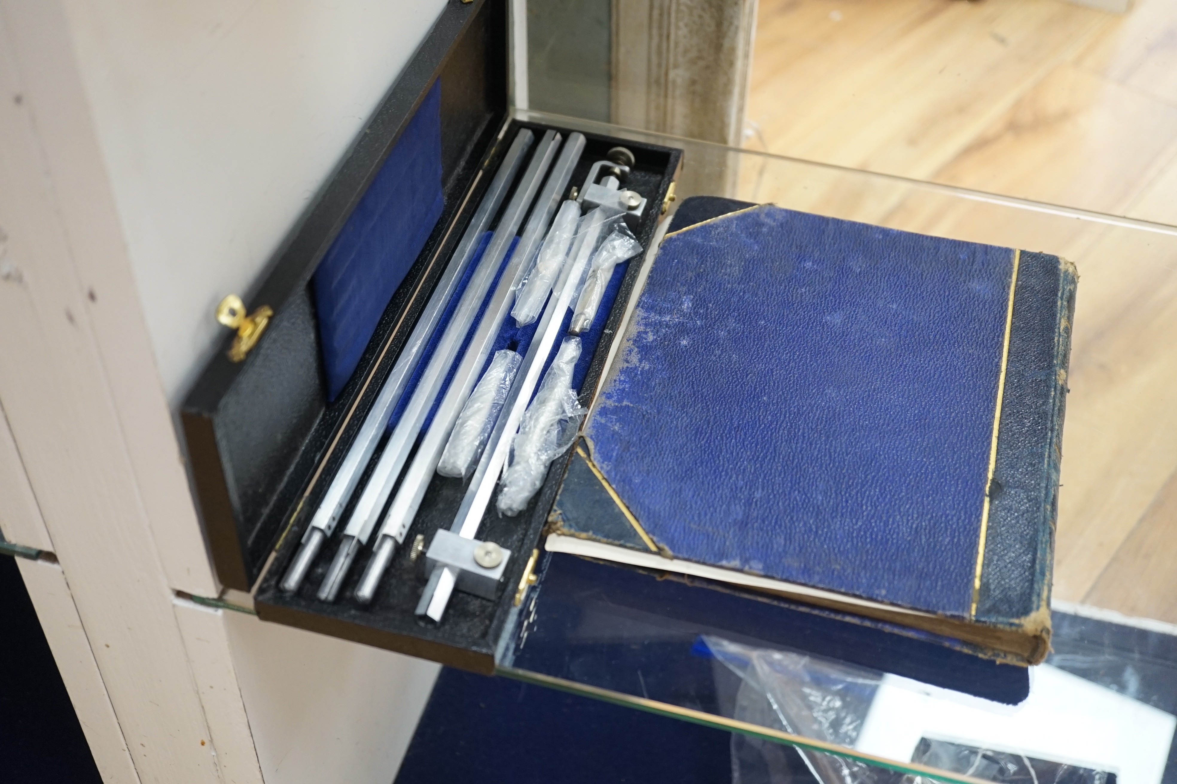 An album of crests and two cased draughtsman's sets